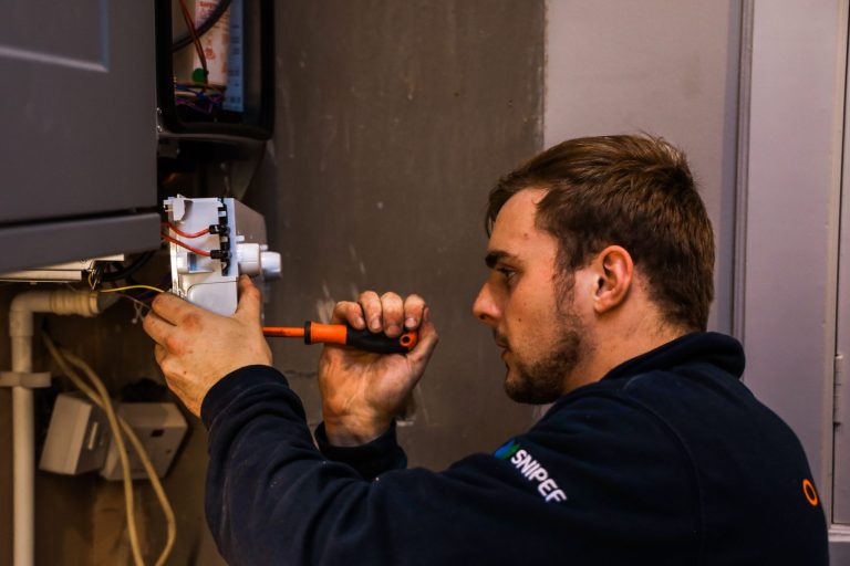 Celsius plumber undertaking a boiler repair in Edinburgh