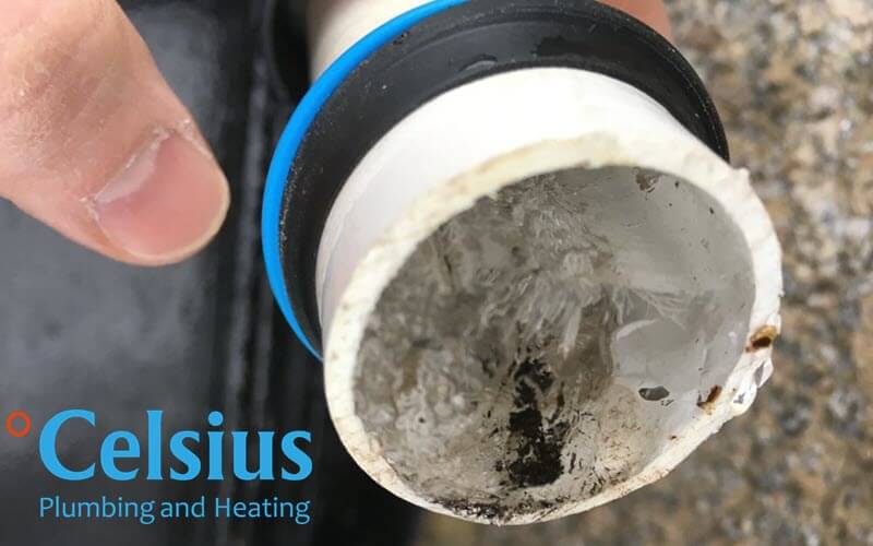 Disconnecting the frozen condensate pipe.