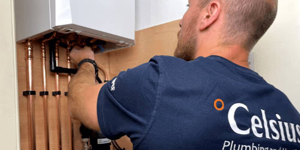 Celsius heating engineer servicing a gas combi boiler in Edinburgh.