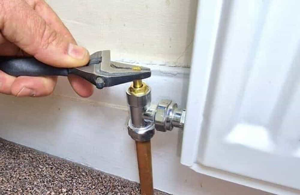 Radiator being balanced by a Celsius plumber.