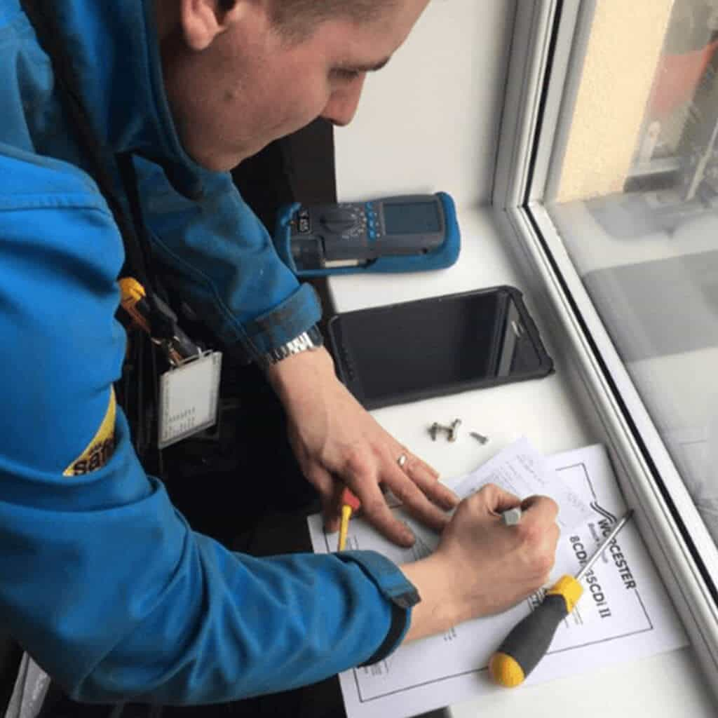 Completing the gas safety checks & certifications at the boiler service.