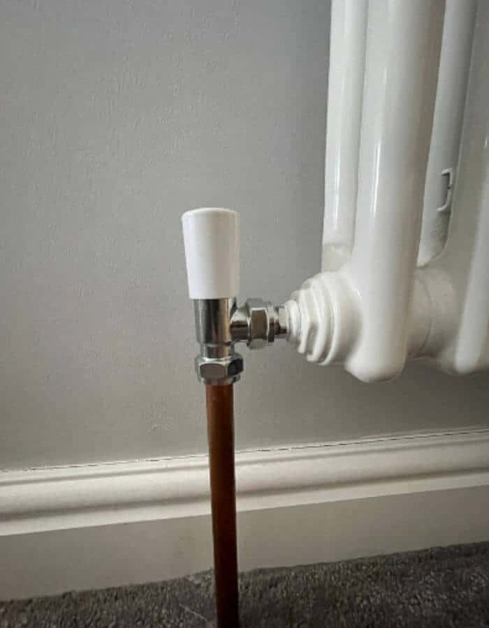 Photo of the existing pipework connecting to the radiator.