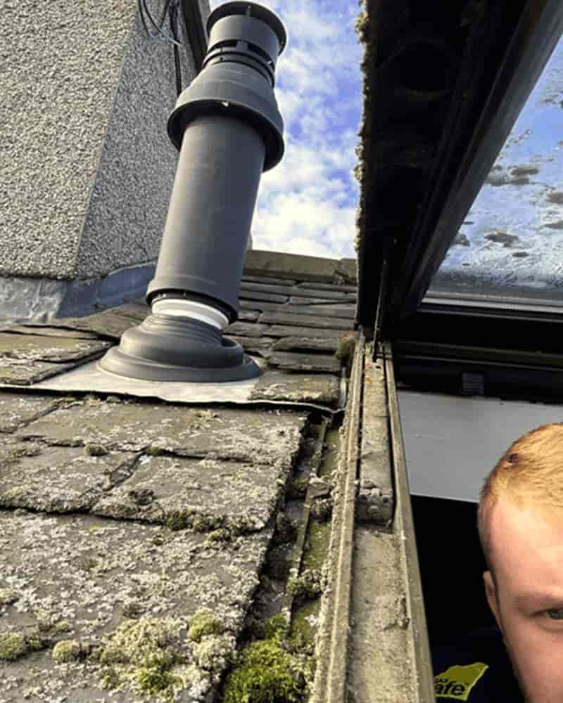 Flue being checked during landlord gas safety check.