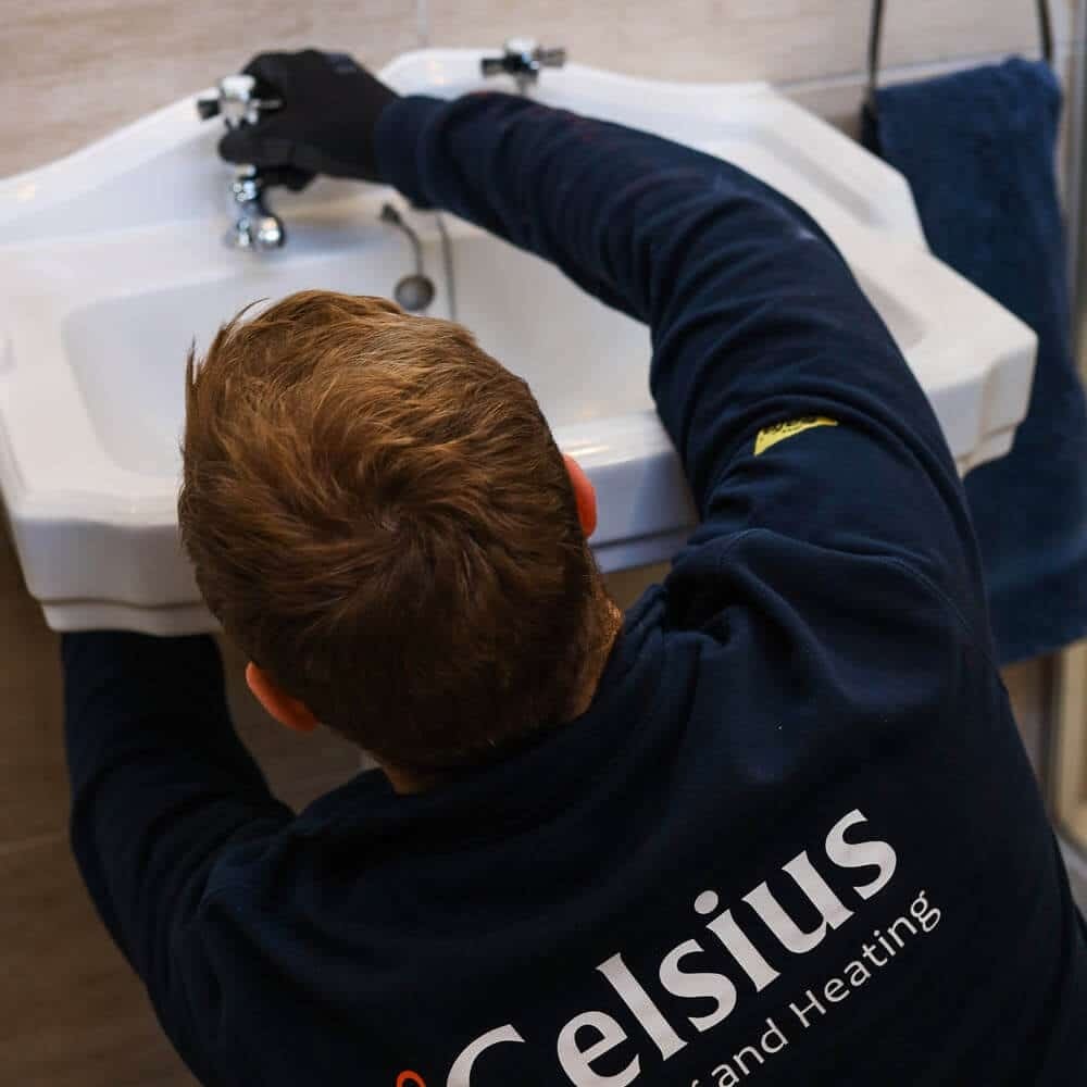 Plumber repairing loose and wobbly taps at a home in Edinburgh.