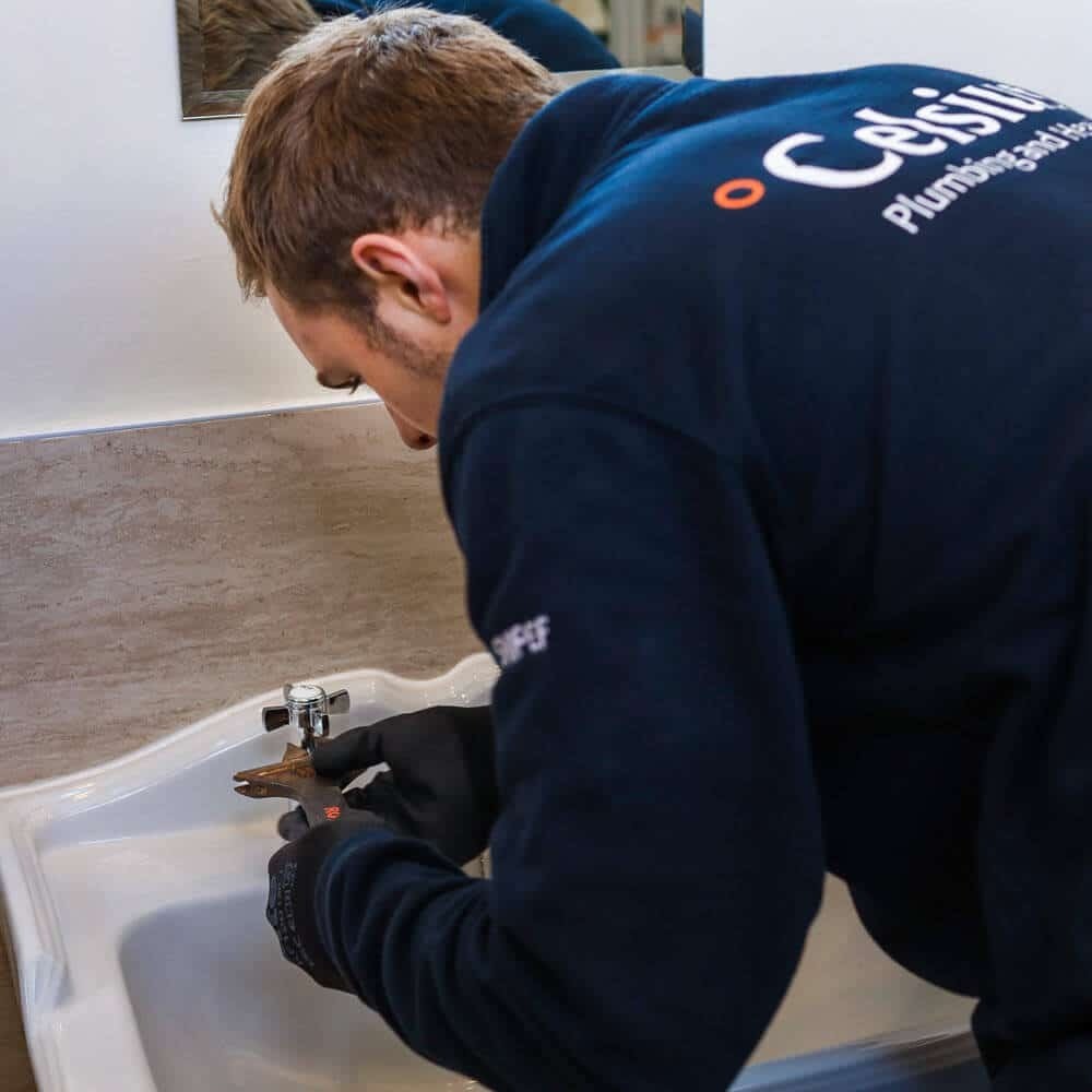 Ceslius plumber replacing a tap washer in Edinburgh.