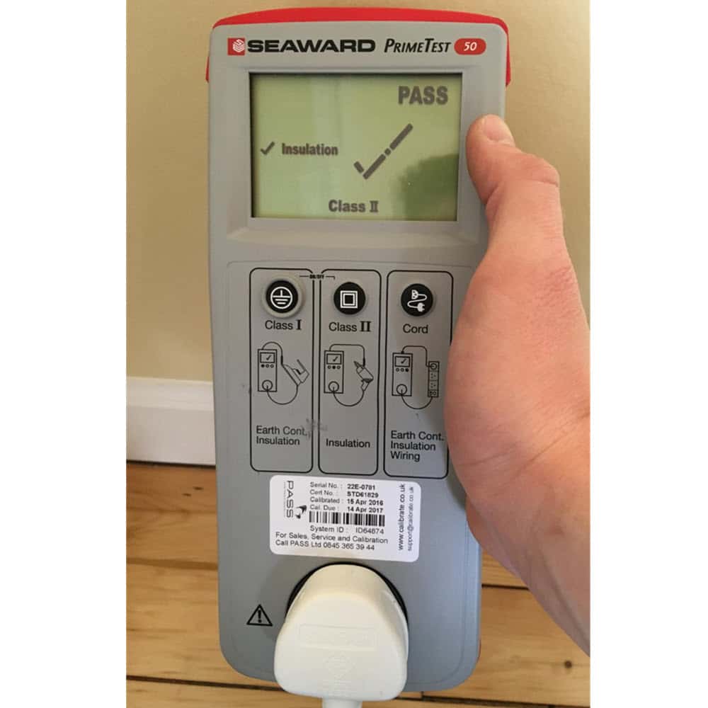 PAT testing equipment showing that an appliance has passed.