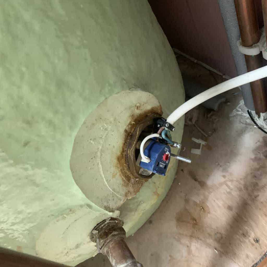 Undertaking a repair to a leaking immersion heater.