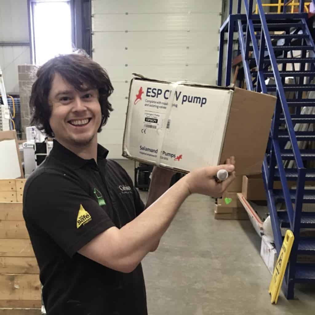 Picking up a shower pump to solve a low water pressure issue.