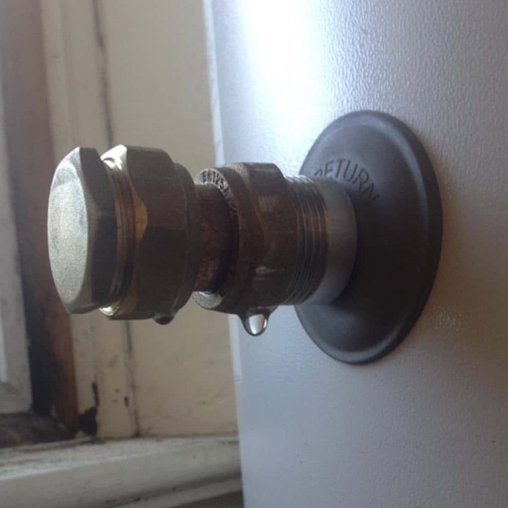 This hot water tank is leaking so needs repaired.