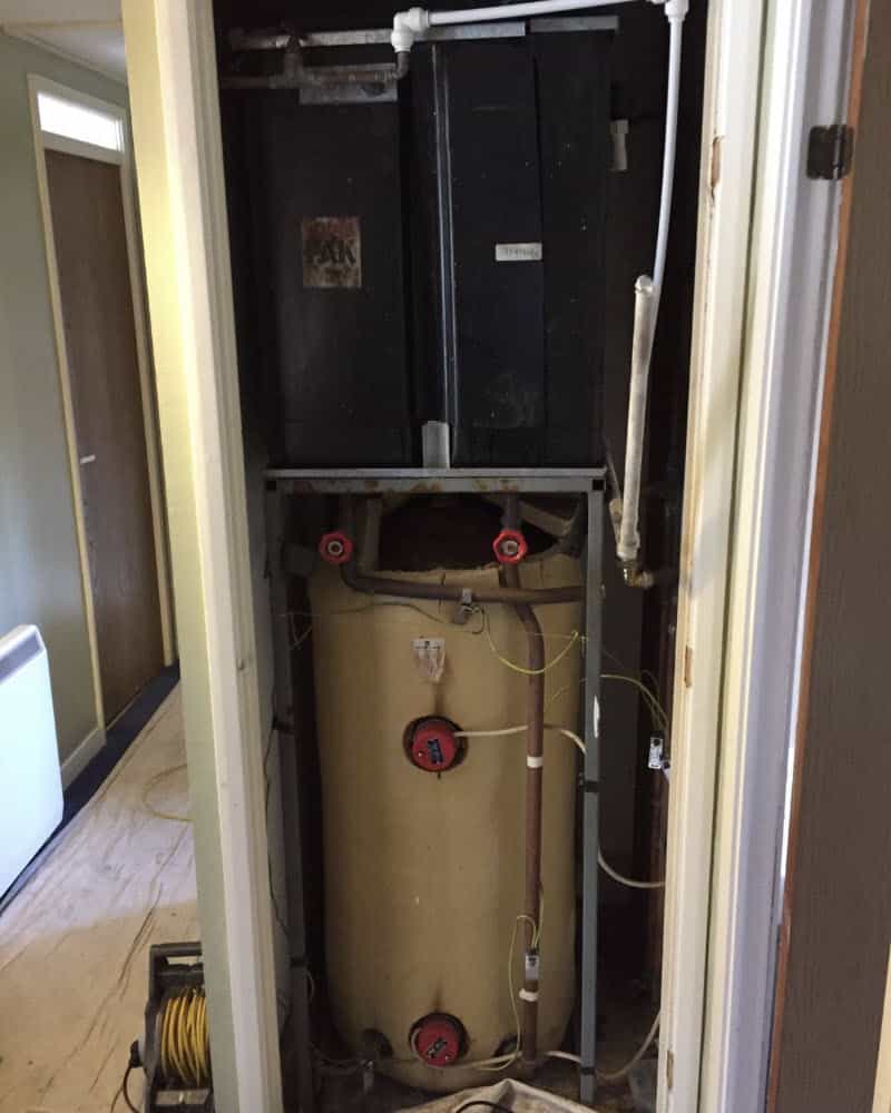 Old set up in Edinburgh flat with hot and cold water tanks in cupboard.