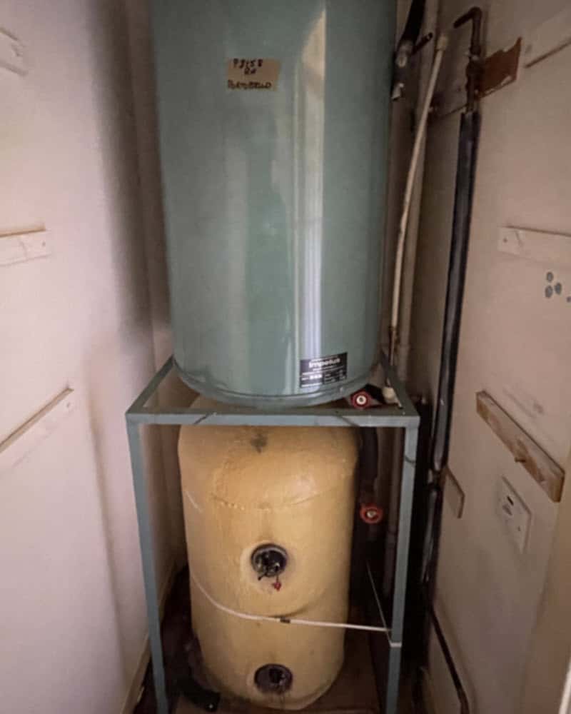 Old water tanks taking up lots of space in this Edinburgh cupboard.