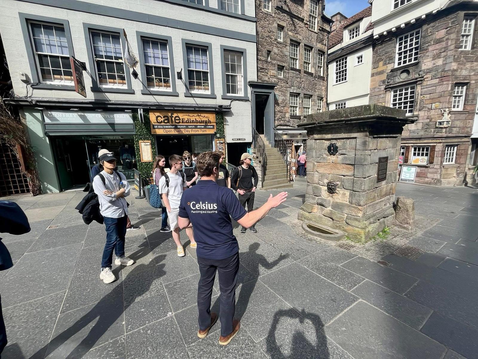 Michael leading a tour showing wellhead plumbing in Edinburgh.
