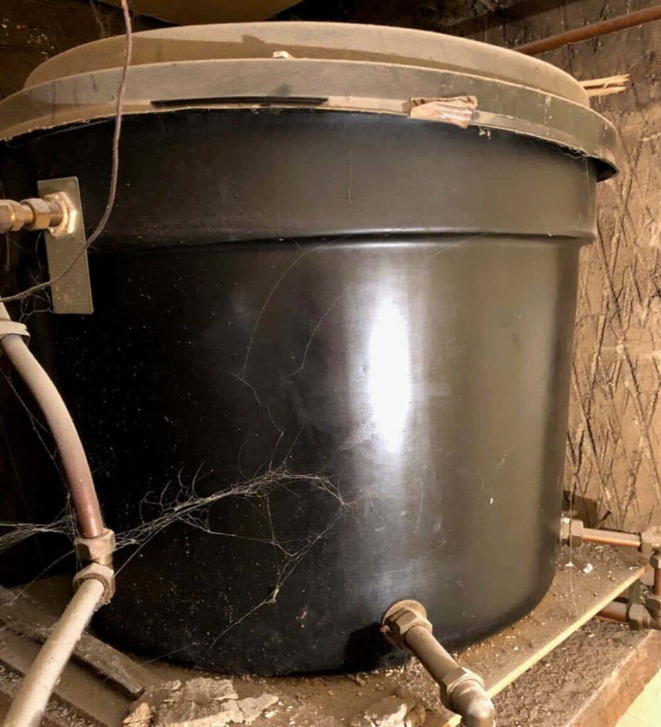 This cold water tank needs replaced and a new water tank installed.