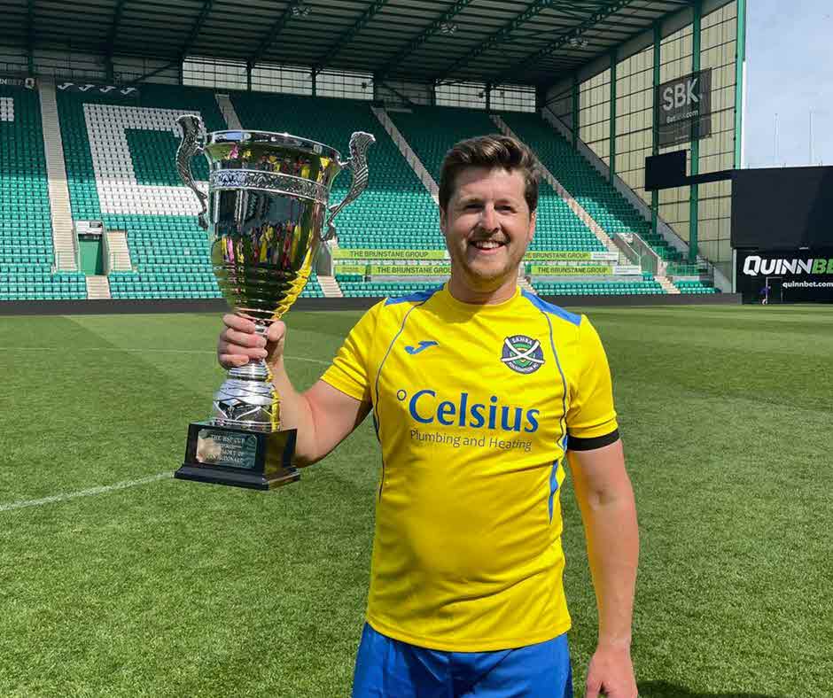 Michael with the Hanlon Stevenson Cup helping to raise funds for charity.