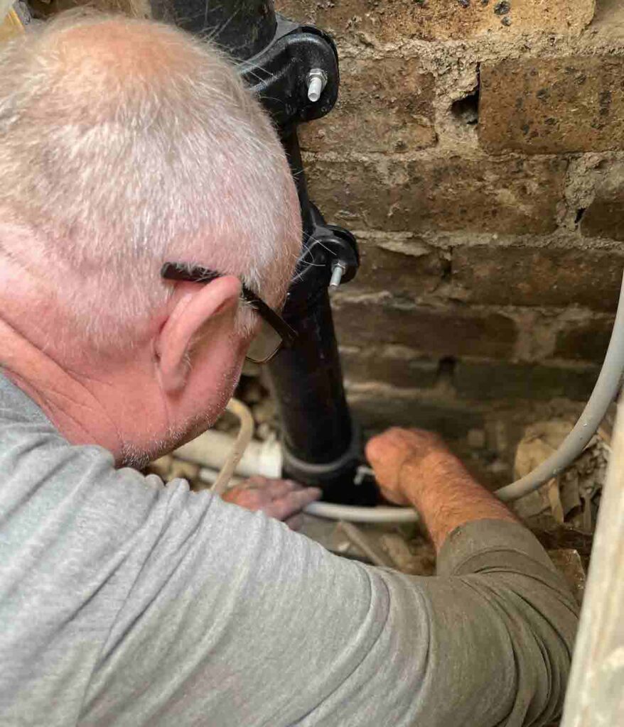 Our plumber Bruce replacing a cast iron drain pipe.